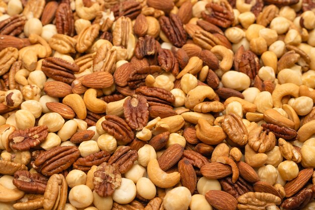 Mix of nuts as a background. Top view.