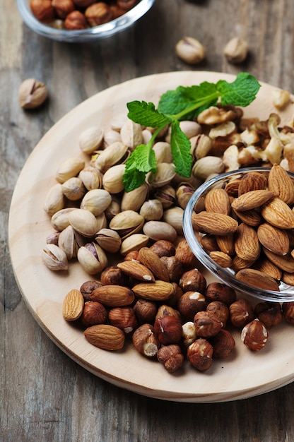 Mix of nuts on the wooden table