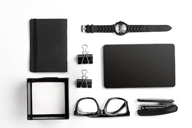 mix of office supplies and business gadgets on a modern desk