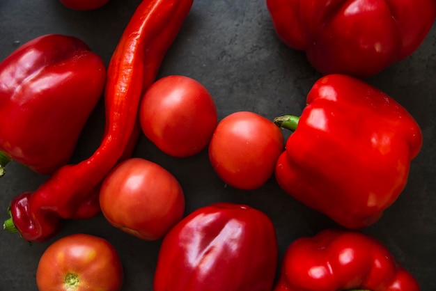 Mix of red vegetables peppers tomatoes and pointed peppers