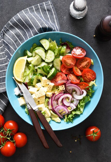 Mix salad with vegetables, leaves and feta