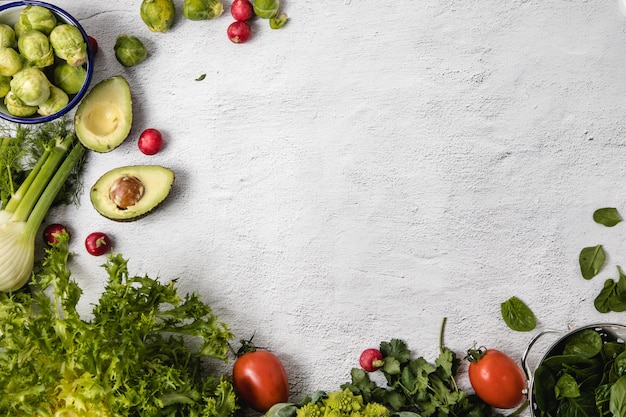 A mix of seasonal vegetables arranged over a white background and placed in a side and the base