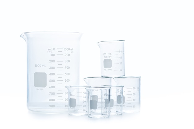 Photo mix size of measuring beakers for science experiment in laboratory isolated on white background, scientific equipment and education concept