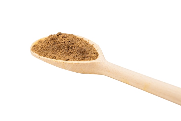 Mix spices on wooden spoon isolated on white.