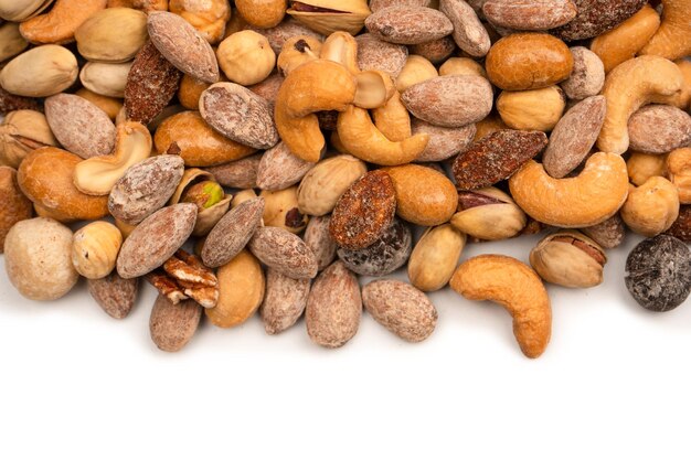 Mix of tasty salty nuts A group of almonds pistachios walnuts macadamia cashews