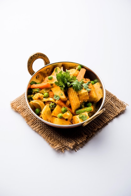 Mix vegetable curry - Indian main course recipe contains Carrots, cauliflower, green peas and beans, baby corn, capsicum and paneer or cottage cheese with traditional masala and curry