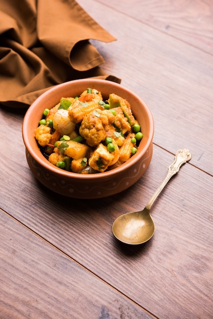 Mix vegetable curry - Indian main course recipe contains Carrots, cauliflower, green peas and beans, baby corn, capsicum and paneer or cottage cheese with traditional masala and curry