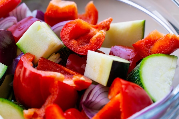 A mix of vegetables for grill in a glass bowl