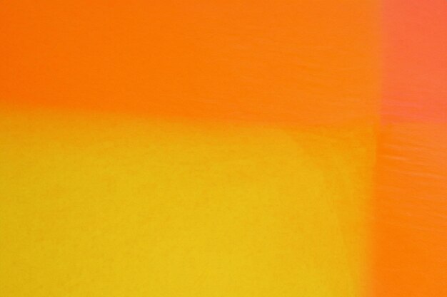 Mix of yellow and orange paint watercolor background
