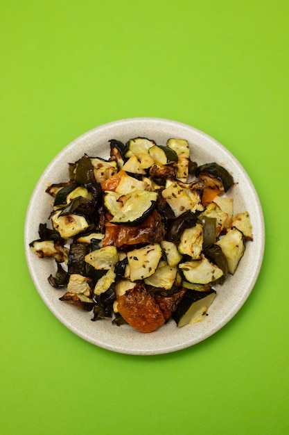 Mixed baked vegetables on light brown dish