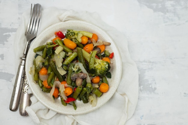 Mixed boiled vegetables on light brown dish