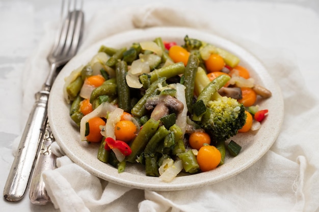 Mixed boiled vegetables on light brown dish