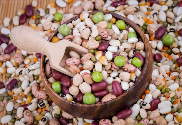 Mixed dried legumes and cereals isolated on white background, top view