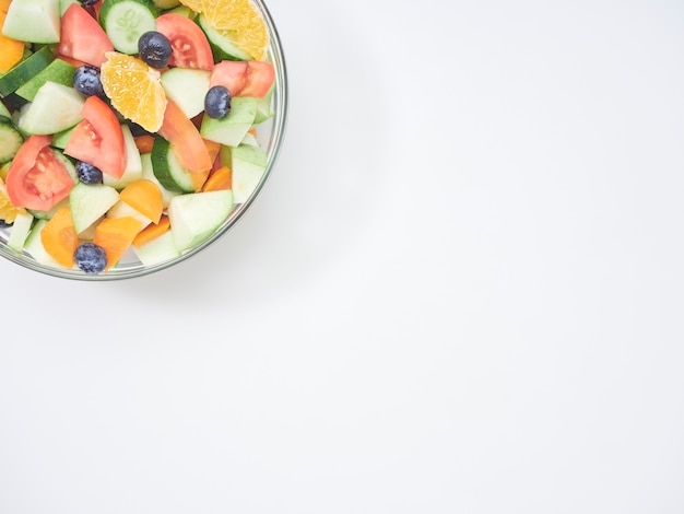 Mixed fruit and vegetable salad in a glass bowl