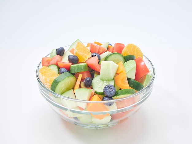 Mixed fruit and vegetable salad in a glass bowl