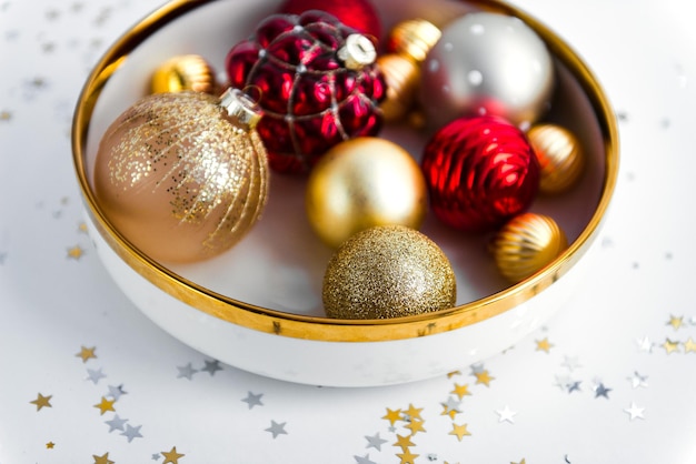 Mixed new year decorations in festive holiday dish