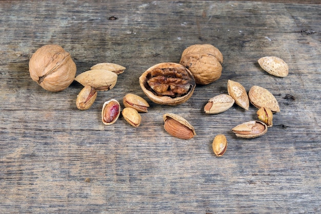 Mixed nut on rustic wood background