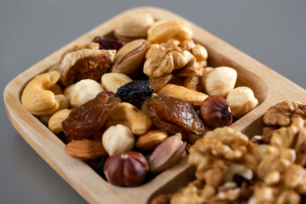 Mixed nuts in a bamboo plate Healthy food concept