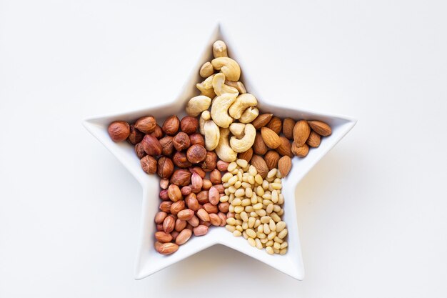 Mixed nuts in a dish in the form of star