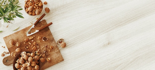 Фото Смешанные орехи на белом деревянном столе сверху. здоровое питание и закуски. грецкие орехи. 3d визуализация иллюстрации