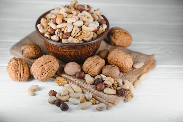 Mixed nuts on a plate White background