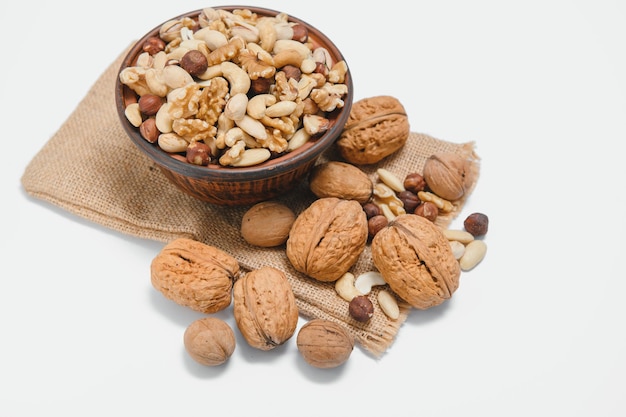 Mixed nuts on a plate White background