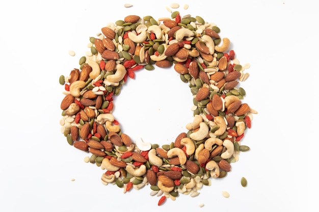 Photo mixed organic cereal and grain seed pile on white background.