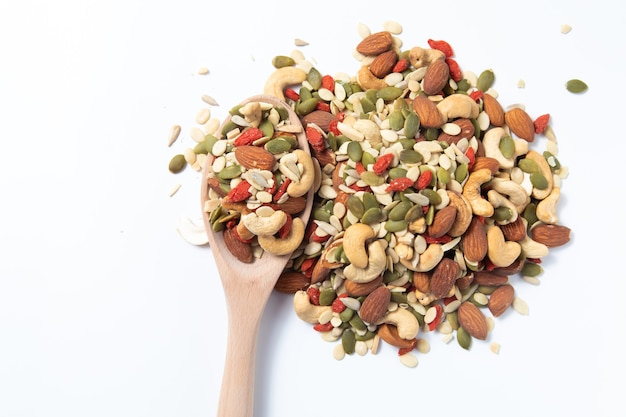 mixed organic cereal and grain seed pile on white background. 