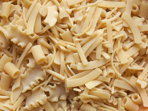 Mixed pasta of various shapes background