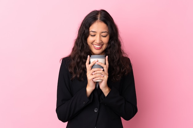 Mixed race business woman holding coffee to take away