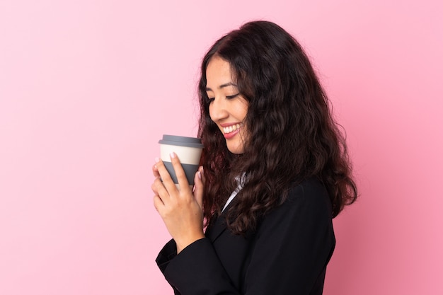 Mixed race business woman holding coffee to take away