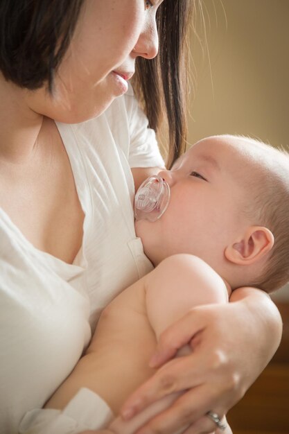 Mixed Race Chinese and Caucasian Baby Boy with His Mother