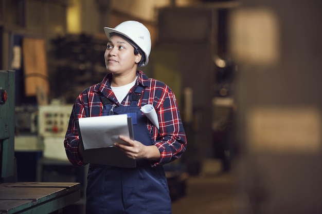 Mixed-Race Female Engineer Working at Plant