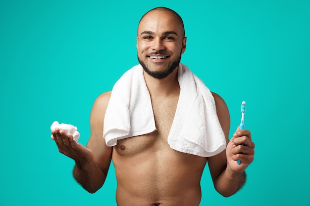 Mixed-race man with towel