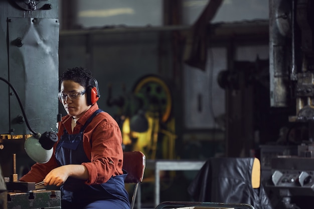 Mixed-Race Woman Working at Plant