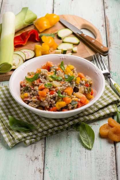 Mixed spelt salad with mixed vegetables and dried apricot