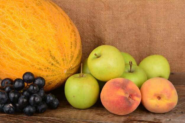 Mixed summer fruits on wooden table