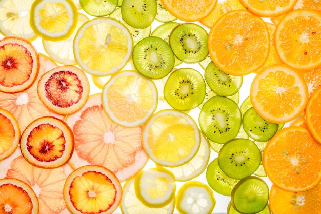 Mixed transparent citrus fruit on white