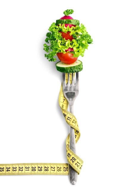 Mixed vegetables on a fork isolated. Diet concept