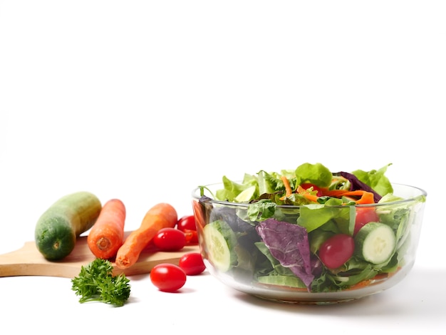 Mixed vegetables salad on white background. 