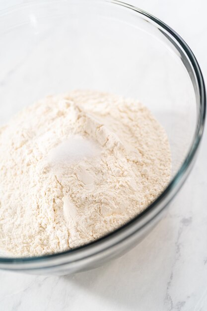 Mixing bread dough in a stand-alone kitchen mixer to bake patriotic cinnamon twists.