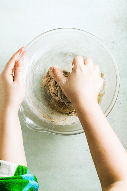 Mixing dough for chocolate cake in a bowl.