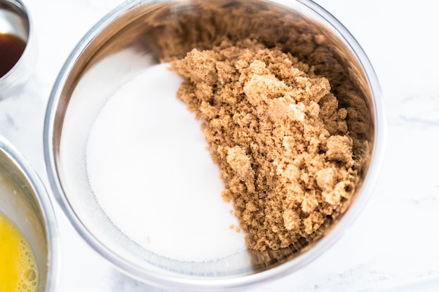 Mixing ingredients to bake peanut butter cookies.