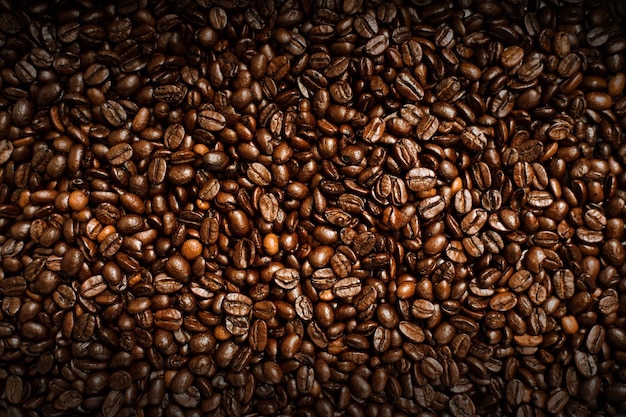 A mixture of different kinds of coffee beans Coffee Background