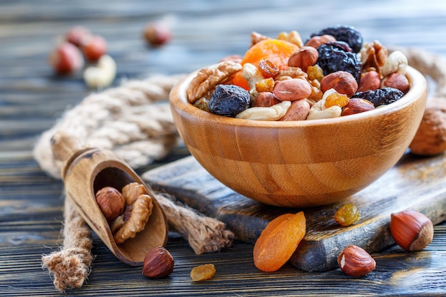 Mixture of nuts and dried fruit in a wooden bowl