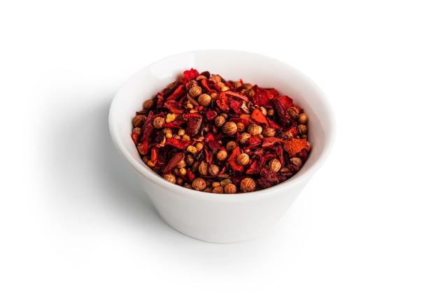 A mixture of peppers isolated on a white background The spice is a mixture of peppers