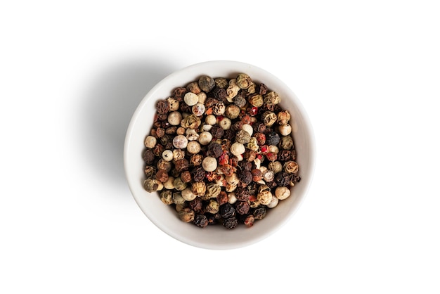 A mixture of peppers isolated on a white background The spice is a mixture of peppers