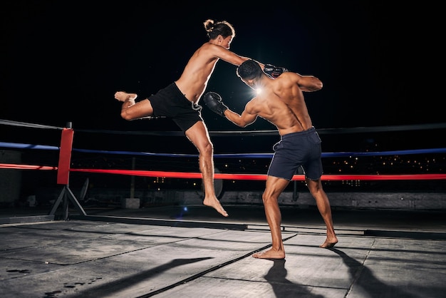 Mma muay thai and fight with a boxing coach and training for health fitness and sport exercise in a ring at the gym Workout sports and cardio in a fighter match fighting for health and cardio