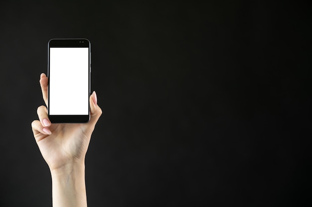 Mobiel entertainment digitale reclame online verbinding vrouwelijke hand met smartphone met blanco