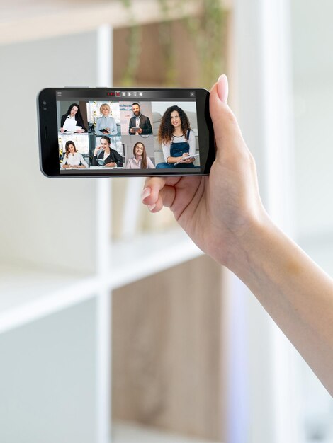 Mobile conference business meeting team on screen